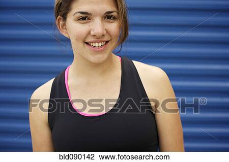 Athletic mixed race woman standing outdoors View Large Photo Image Stock Image - Athletic mixed race woman standing outdoors. Fotosearch