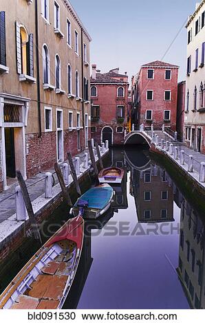Boats moored on tranquil canal View Large Photo Image Stock Image - Boats moored on tranquil canal. Fotosearch