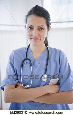 Stock Image - Brazilian doctor with arms crossed. Fotosearch
