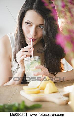 Brazilian woman drinking lemonade View Large Photo Image Stock Image - Brazilian woman drinking lemonade. Fotosearch
