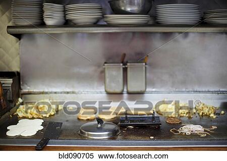 Stock Photography - Breakfast cooking on diner griddle. Fotosearch