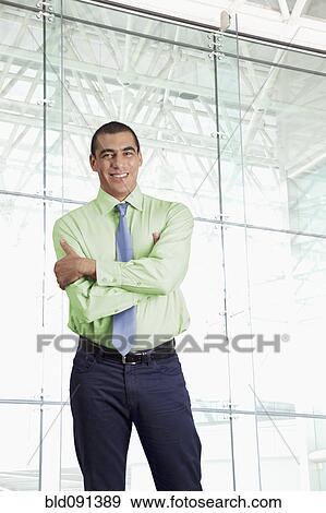 Stock Photo - Businessman standing in airport. Fotosearch