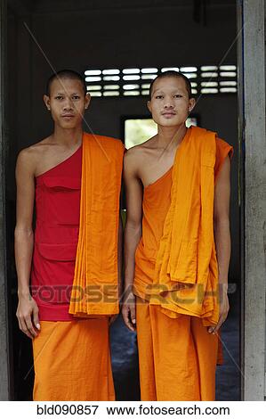 Stock Photo - Cambodian monks standing in doorway. Fotosearch