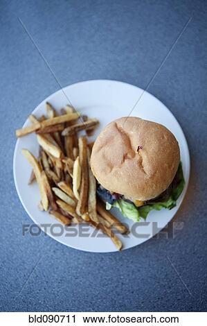 Stock Image - Cheeseburger and french fries. Fotosearch