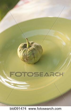 Picture - Close up of pod on plate. Fotosearch
