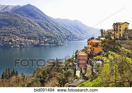 Houses on hillside next to remote lake View Large Photo Image Picture - Houses on hillside next to remote lake. Fotosearch