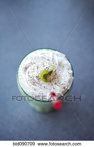 Milkshake and straw in glass View Large Photo Image Stock Photo - Milkshake and straw in glass. Fotosearch