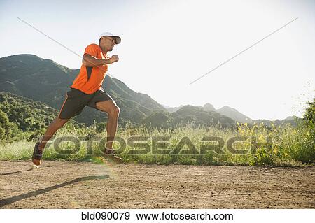 Mixed race man running on remote trail View Large Photo Image Stock Photo - Mixed race man running on remote trail. Fotosearch