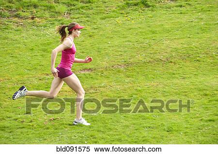 Mixed race woman running in field View Large Photo Image Stock Photography - Mixed race woman running in field. Fotosearch
