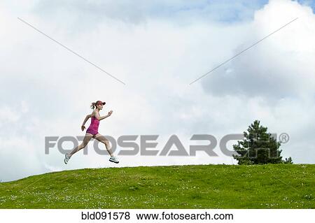Mixed race woman running outdoors View Large Photo Image Stock Photo - Mixed race woman running outdoors. Fotosearch