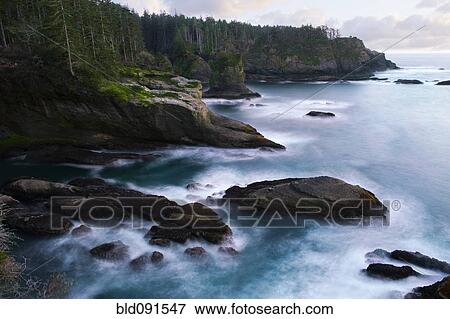 Stock Photo - Ocean and rocky shore of remote area. Fotosearch
