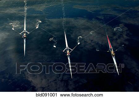 People rowing sculling boats on river View Large Photo Image Stock Image - People rowing sculling boats on river. Fotosearch
