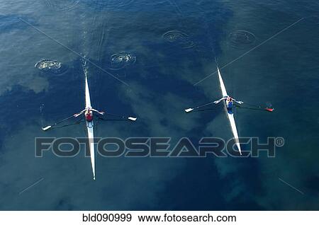 People rowing sculling boats on river View Large Photo Image Stock Photo - People rowing sculling boats on river. Fotosearch