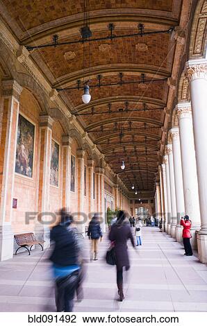 People walking underneath ornate portico View Large Photo Image Stock Image - People walking underneath ornate portico. Fotosearch