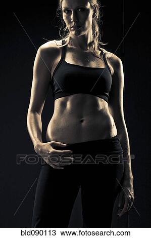 Serious athletic woman in sportswear View Large Photo Image Stock Image - Serious athletic woman in sportswear. Fotosearch