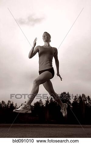 Serious Caucasian woman running View Large Photo Image Stock Image - Serious Caucasian woman running. Fotosearch