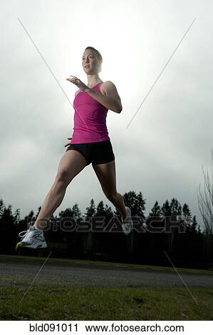 Serious Caucasian woman running View Large Photo Image Stock Image - Serious Caucasian woman running. Fotosearch