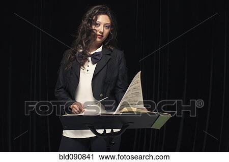 Serious mixed race conductor View Large Photo Image Stock Image - Serious mixed race conductor. Fotosearch