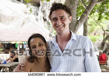 Smiling couple hugging View Large Photo Image Stock Image - Smiling couple hugging. Fotosearch