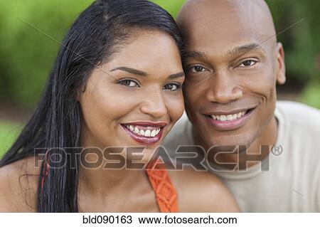 Smiling couple outdoors View Large Photo Image Stock Image - Smiling couple outdoors. Fotosearch