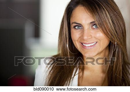 Stock Image - Smiling Hispanic businesswoman. Fotosearch
