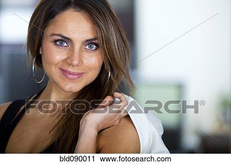 Stock Image - Smiling Hispanic businesswoman. Fotosearch