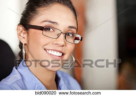 Stock Image - Smiling Hispanic businesswoman. Fotosearch
