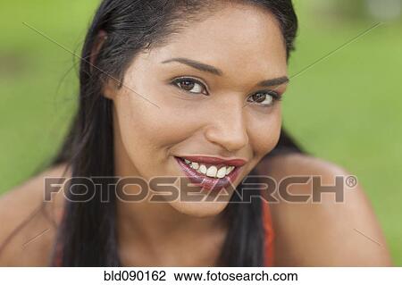 Stock Image - Smiling mixed race woman. Fotosearch