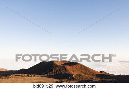 Stock Photo - Volcano against blue sky. Fotosearch