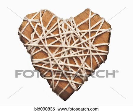 Stock Photography - Wooden heart wrapped in string. Fotosearch