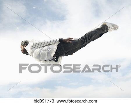 African American man flying through mid-air View Large Photo Image Stock Image - African American man flying through mid-air. Fotosearch
