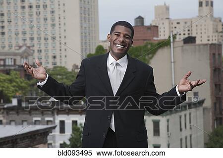 African American man in suit standing on rooftop View Large Photo Image Stock Photography - African American man in suit standing on rooftop. Fotosearch