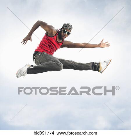 African American man jumping in mid-air View Large Photo Image Picture - African American man jumping in mid-air. Fotosearch