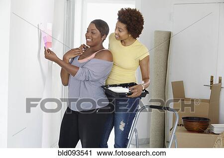 African American mother and daughter painting room View Large Photo Image Stock Image - African American mother and daughter painting room. Fotosearch
