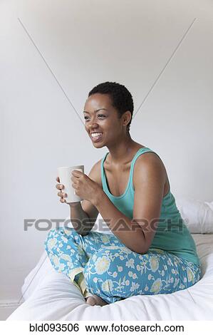 African American woman drinking coffee in bed View Large Photo Image Stock Photograph - African American woman drinking coffee in bed. Fotosearch