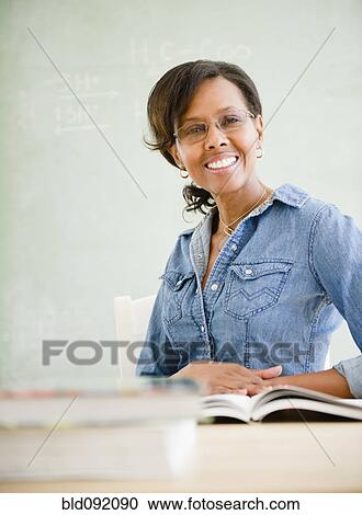 Black teacher in classroom View Large Photo Image Stock Image - Black teacher in classroom. Fotosearch