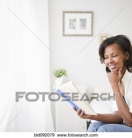 Black woman reading book View Large Photo Image Stock Photo - Black woman reading book. Fotosearch