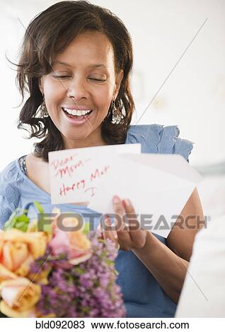 Black woman receiving bouquet of flowers View Large Photo Image Stock Image - Black woman receiving bouquet of flowers. Fotosearch