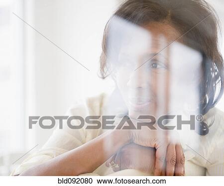 Stock Image - Black woman thinking. Fotosearch
