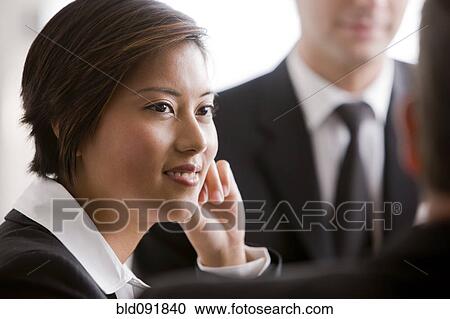 Business people working together in meeting View Large Photo Image Stock Image - Business people working together in meeting. Fotosearch