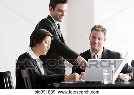 Business people working together in meeting View Large Photo Image Stock Photo - Business people working together in meeting. Fotosearch