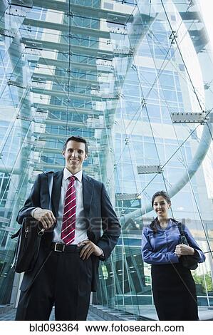 Caucasian business people standing outdoors View Large Photo Image Picture - Caucasian business people standing outdoors. Fotosearch