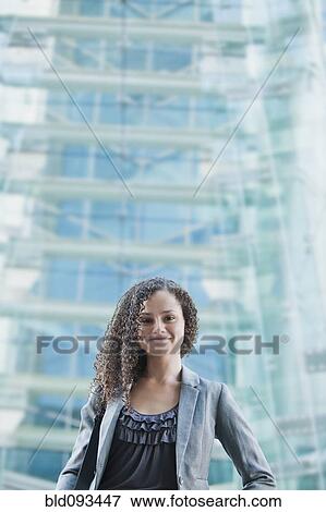 Stock Photo - Caucasian businesswoman standing outdoors. Fotosearch