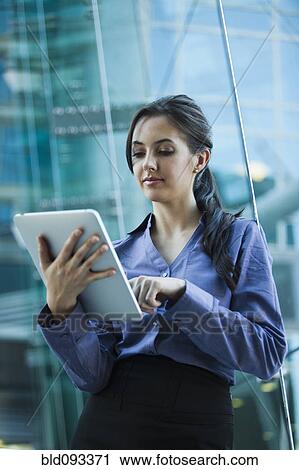 Caucasian businesswoman using digital tablet View Large Photo Image Stock Image - Caucasian businesswoman using digital tablet. Fotosearch