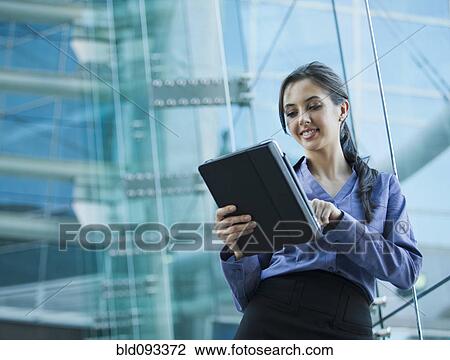 Caucasian businesswoman using digital tablet View Large Photo Image Stock Image - Caucasian businesswoman using digital tablet. Fotosearch