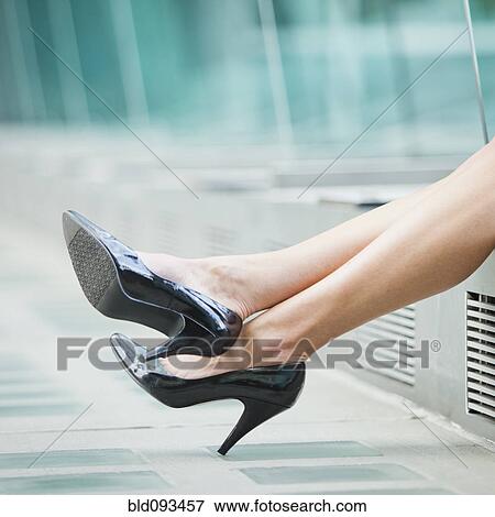 Caucasian businesswoman's legs wearing high heeled shoes View Large Photo Image Stock Photo - Caucasian businesswoman's legs wearing high heeled shoes. Fotosearch