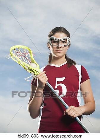 Stock Image - Caucasian teenage lacrosse player. Fotosearch