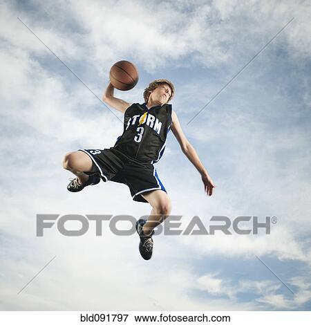 Caucasian teenager playing basketball View Large Photo Image Stock Photo - Caucasian teenager playing basketball. Fotosearch