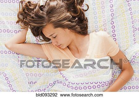 Caucasian teenager sleeping in bed View Large Photo Image Stock Image - Caucasian teenager sleeping in bed. Fotosearch