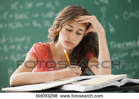 Caucasian teenager studying in classroom View Large Photo Image Stock Photo - Caucasian teenager studying in classroom. Fotosearch